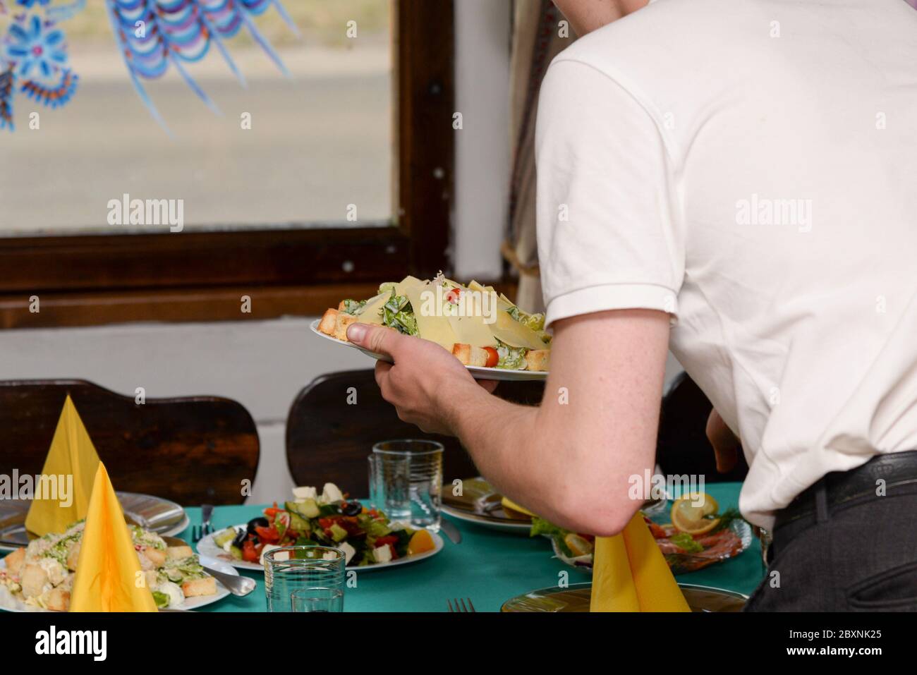 Waiter serves banquet table hi-res stock photography and images - Alamy