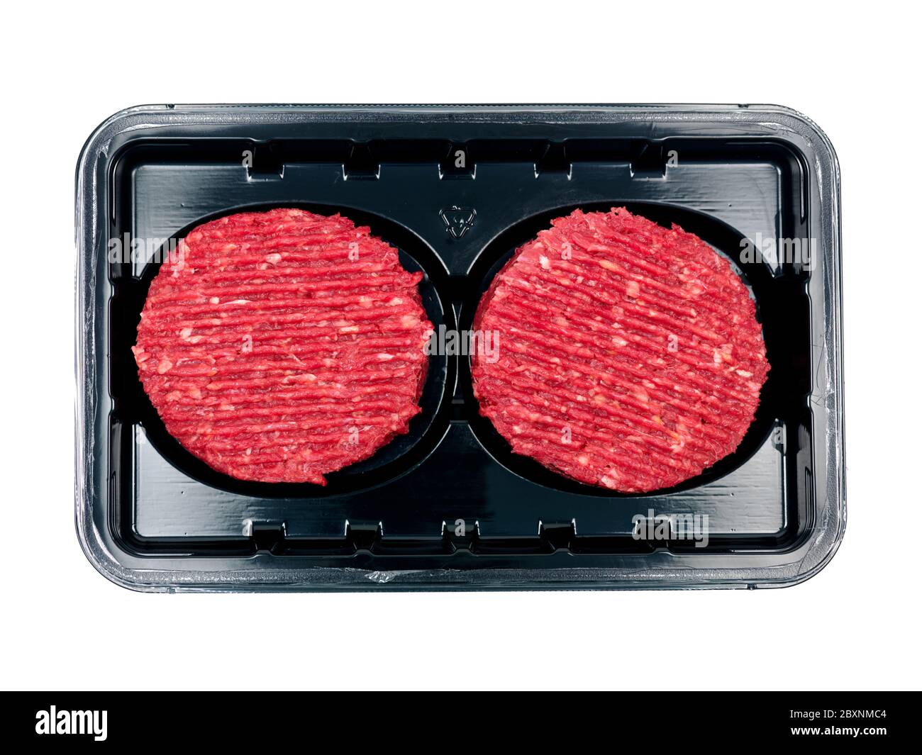 Burger patties in a supermarket packaging tray isolated on a white background Stock Photo