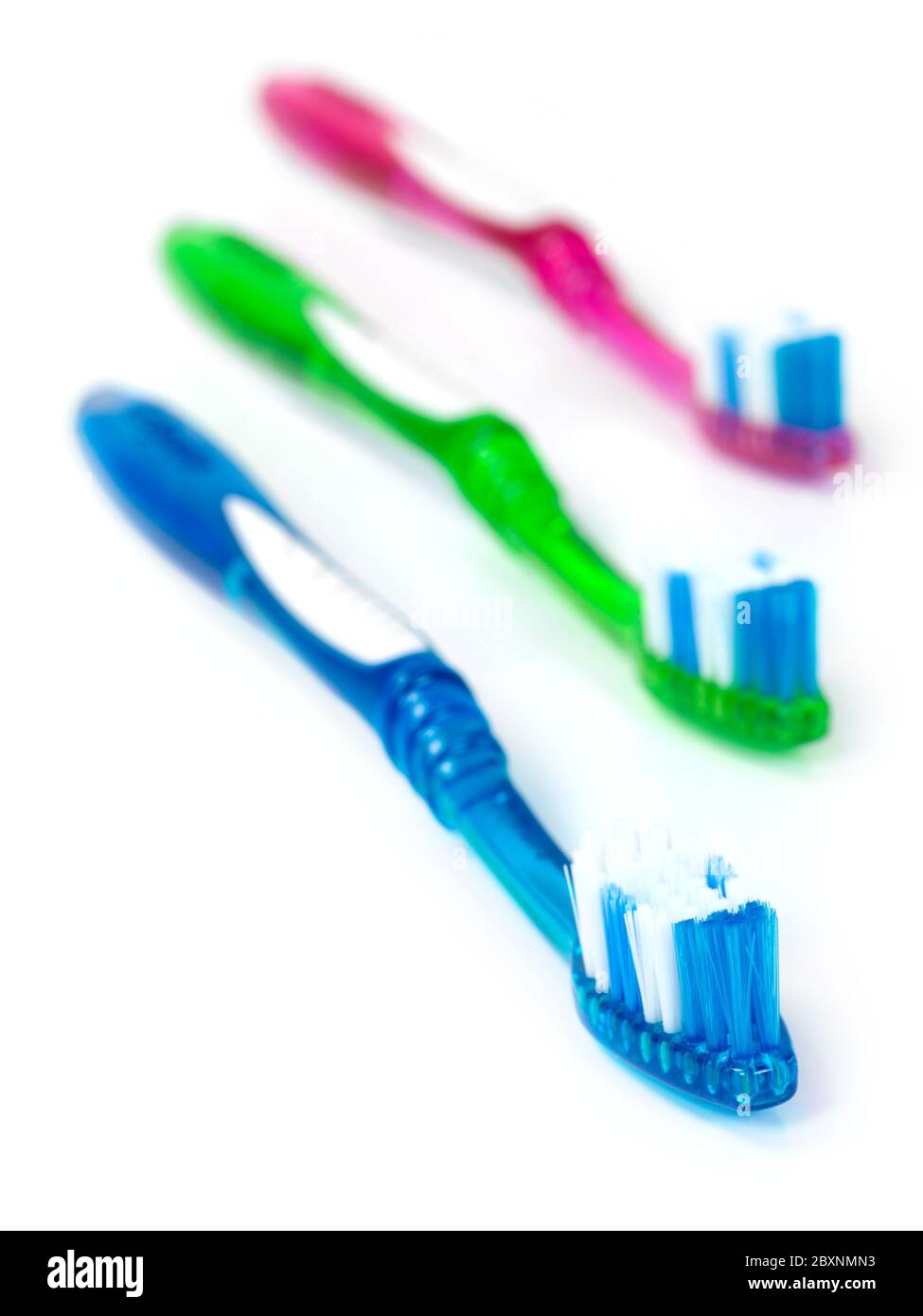 Toothbrushes isolated against a white background Stock Photo - Alamy