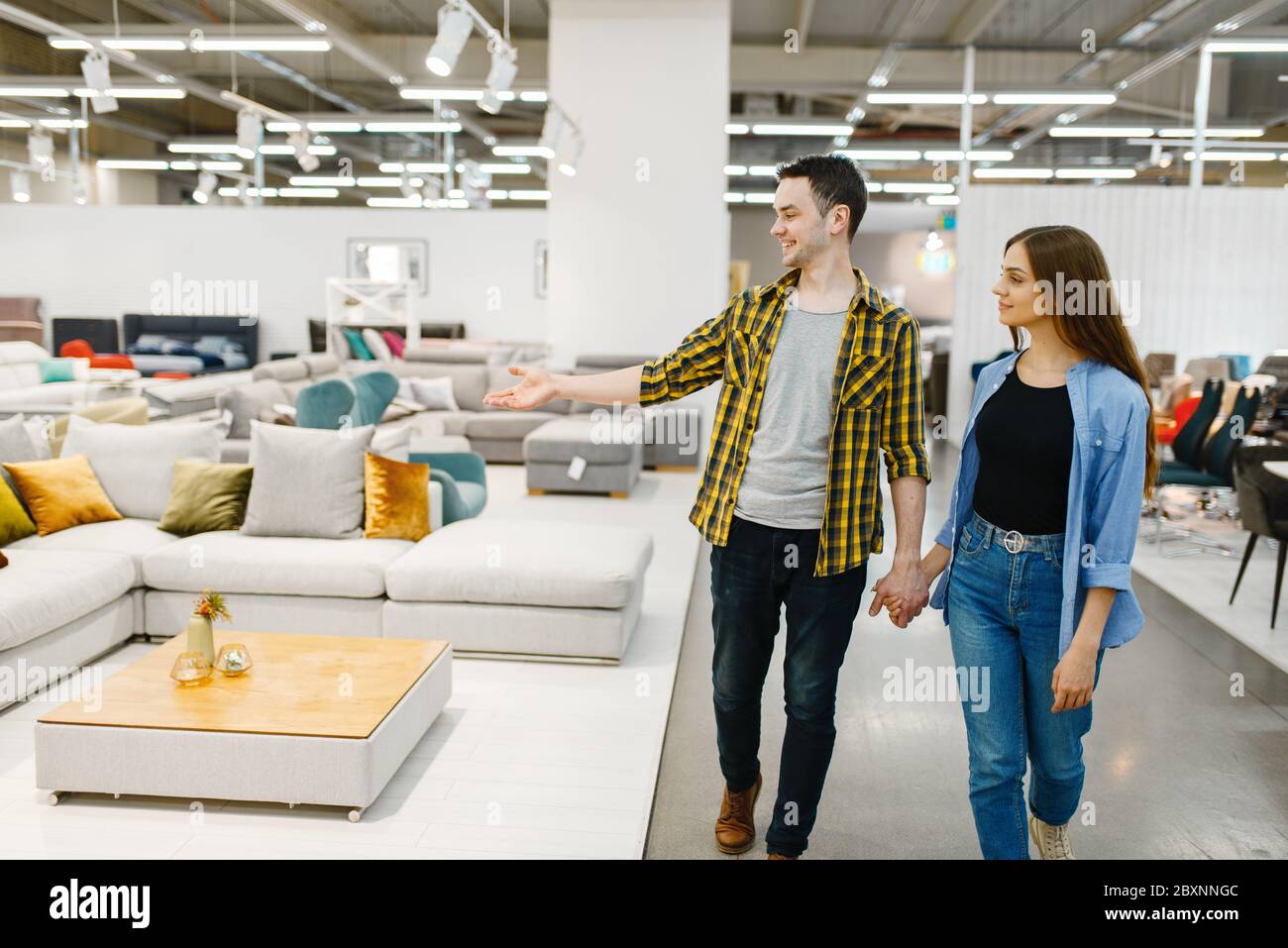 Woman sofa shop happy furniture hires stock photography and images Alamy