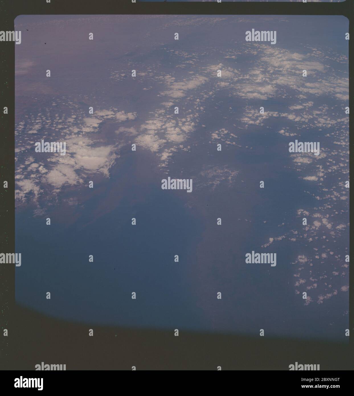 AS07-06-1706 - Apollo 7 - Apollo 7 Mission, India, Gulf of Cambay; Scope and content:  The original database describes this as: Description: Apollo 7,India,Gulf of Cambay. Dark,low oblique. Cloud Cover 35%%. Latitude: Altitude: 122 miles. 21 degrees 00' North,Longitude: 73 degrees 00' East. Original film magazine was labeled O. Camera Data: Hasselblad 500-C; Lens: Zeiss Planar,F/2.8,80mm; Film Type: Kodak SO-121,Aerial Ektachrome; Filter: Wratten 2A. Flight Date: October 11-12. 1968. Subject Terms: Apollo 7 Flight, Earth Observations (From Space), India, Asia Categories: Earth Observations Ori Stock Photo