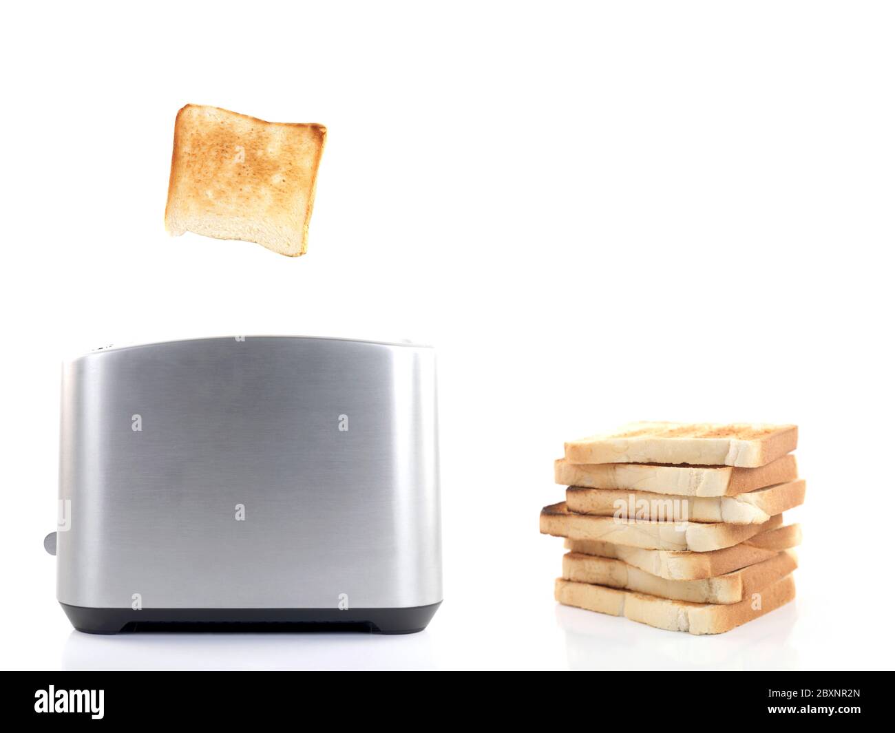 Plain white toast popping up from a toaster isolated against a white background Stock Photo Alamy