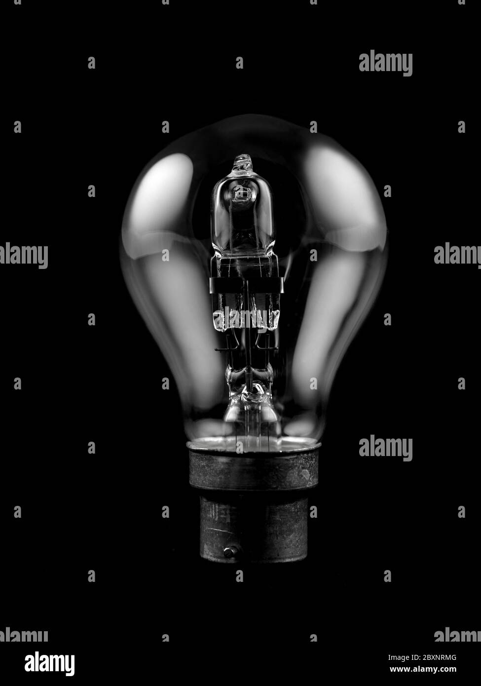 An incandescent light globe isolated against a black background Stock Photo Alamy