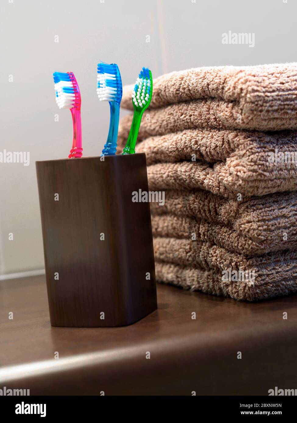 Toothbrushes in toothbrush holder in a bathroom Stock Photo Alamy