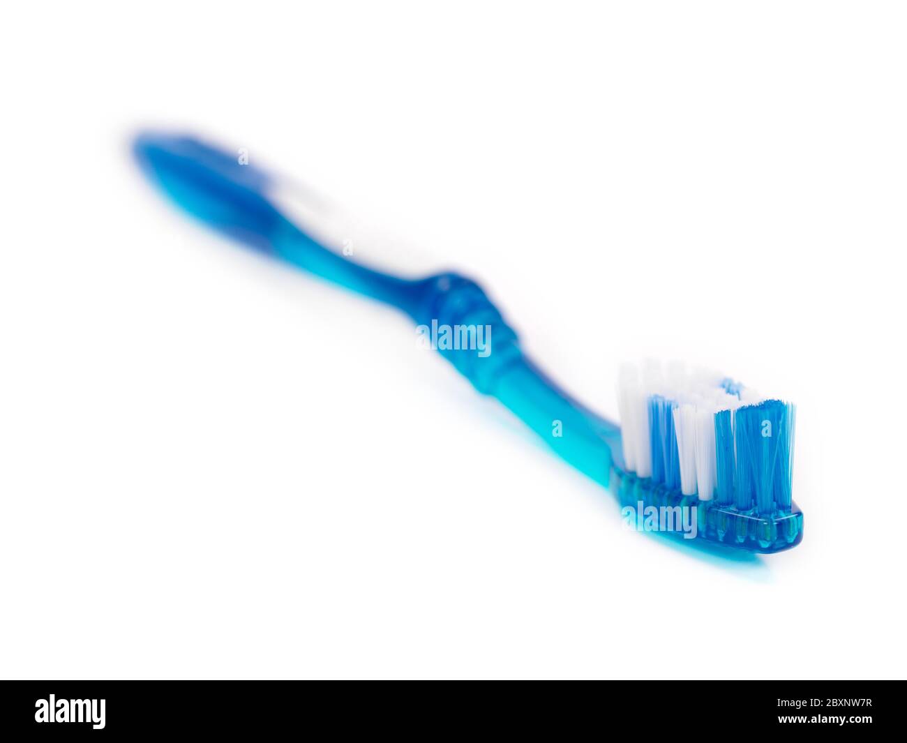 A toothbrush isolated against a white background Stock Photo - Alamy