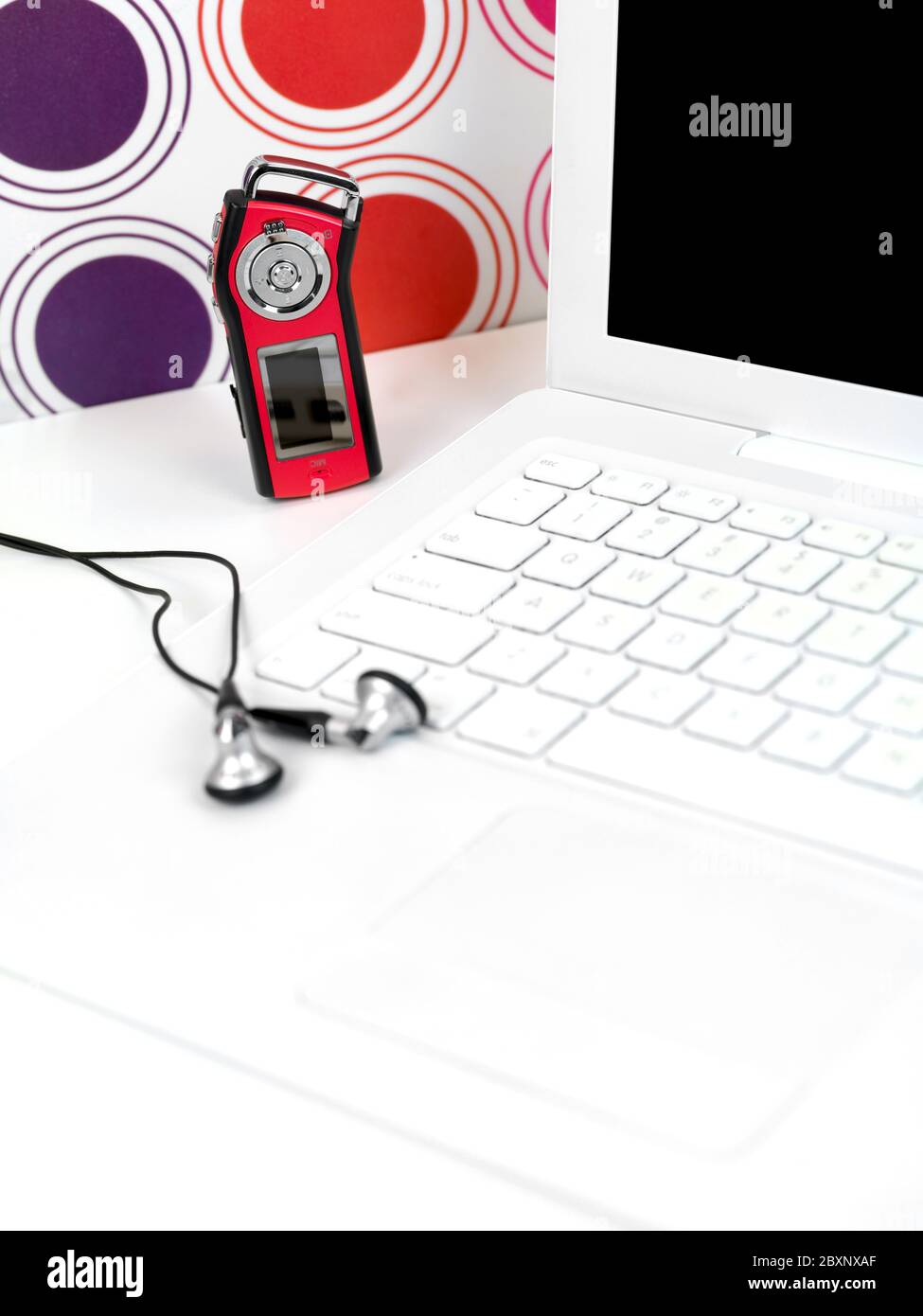An MP3 player and a laptop on a teenagers study desk Stock Photo Alamy
