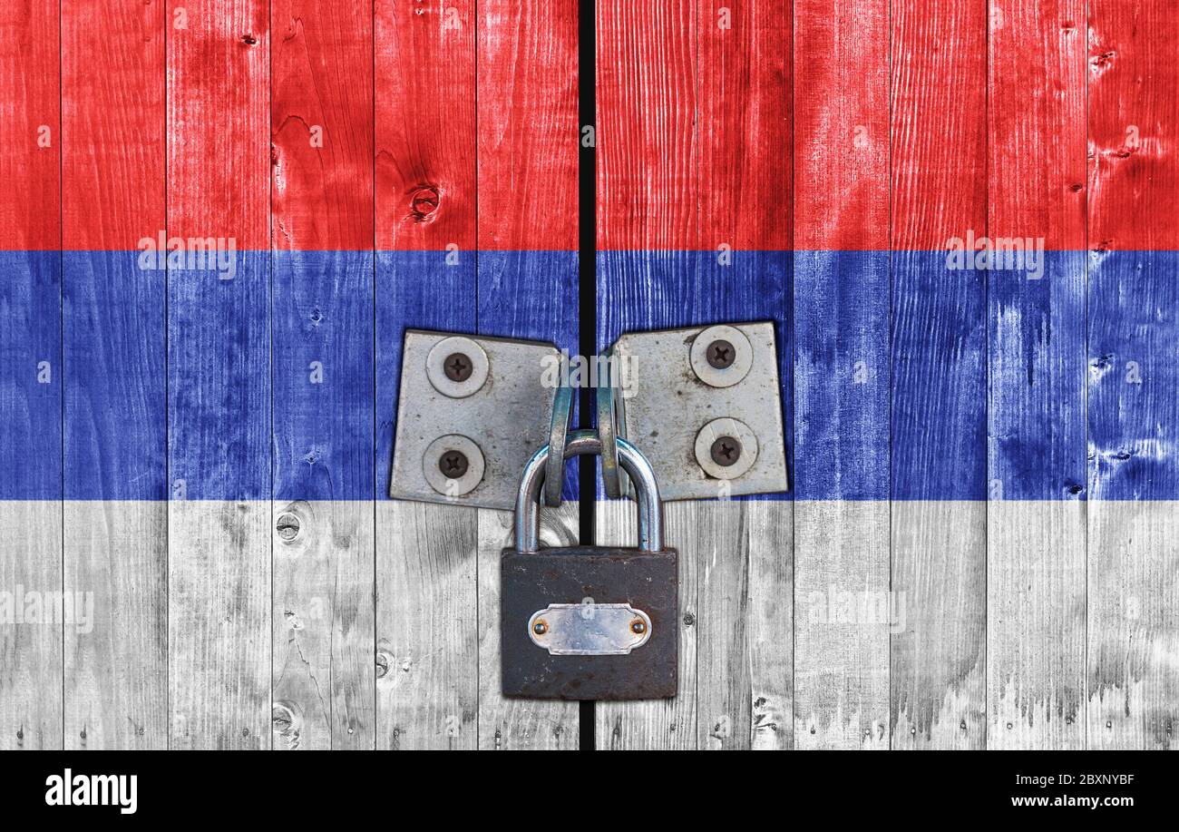 Serbian Republic flag on door with padlock Stock Photo