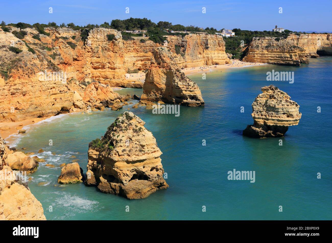 Portugal, Algarve. The Atlantic Ocean washing beautiful cliffs and pristine golden sandy beaches on the Portuguese South Photo -