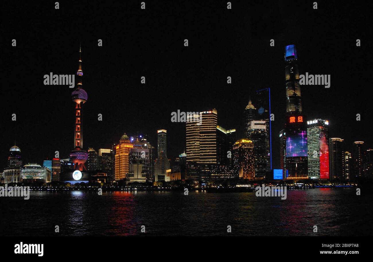 Shanghai, China at night.  The tall modern buildings in the business district of Lujiazui in Pudong, Shanghai. Wide view of the Shanghai skyline. Stock Photo