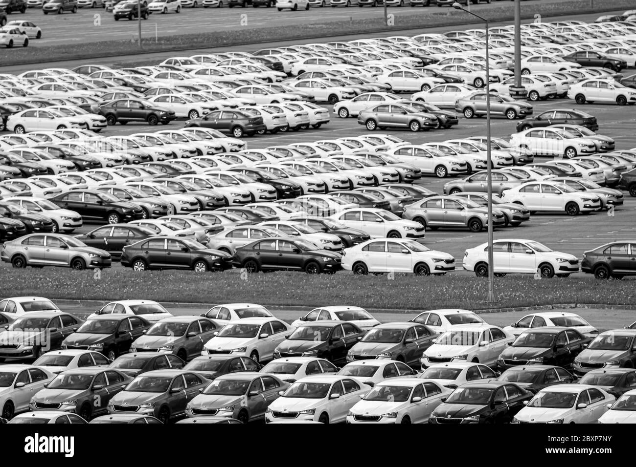 Volkswagen Group Rus, Russia, Kaluga  - MAY 24, 2020: Rows of a new cars parked in a distribution center. Top view to the parking in the open air. Stock Photo