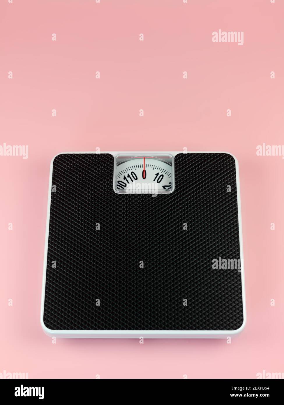 https://c8.alamy.com/comp/2BXPB64/a-set-of-bathroom-scales-isolated-against-a-pink-background-2BXPB64.jpg