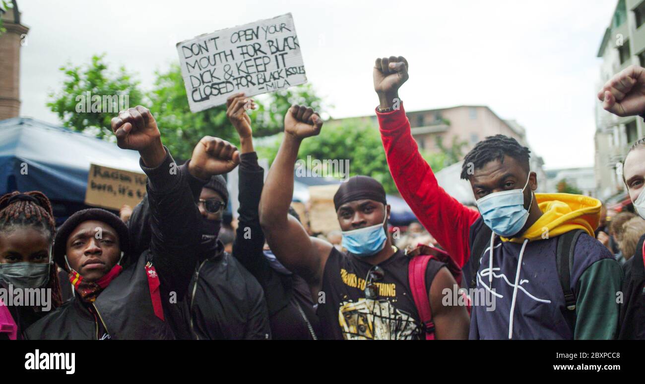 Black Lives Matter Rally, Frankfurt, Germany. June 6th 2020. Young black men raising fists against racism at rally. Stock Photo