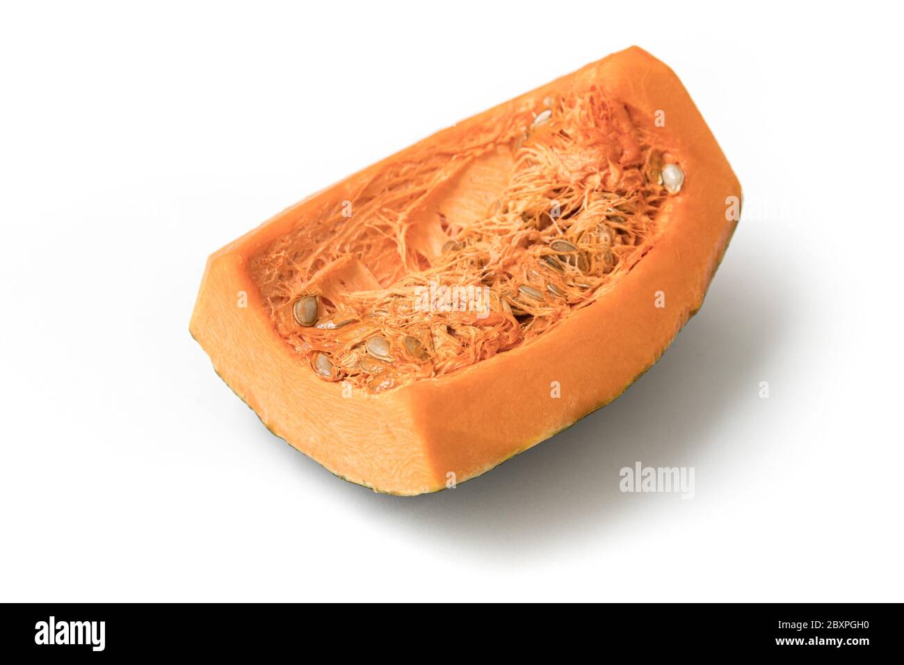 Piece of Pumpkin with seeds isolated on white background Stock Photo