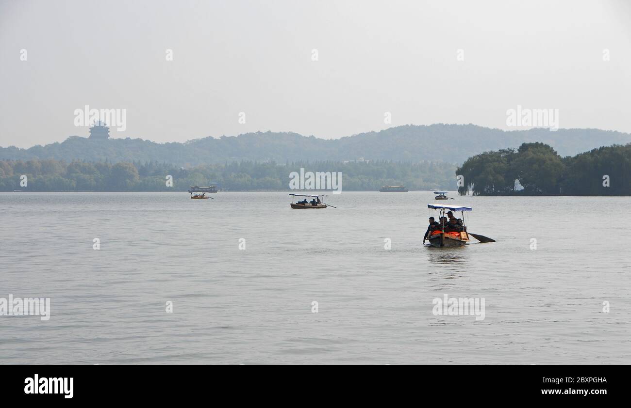 West Lake (Xi Hu) in Hangzhou, Zhejiang Province, China. View the City God Pavilion and tourist boats from Gushan Hill on the north shore of West Lake Stock Photo