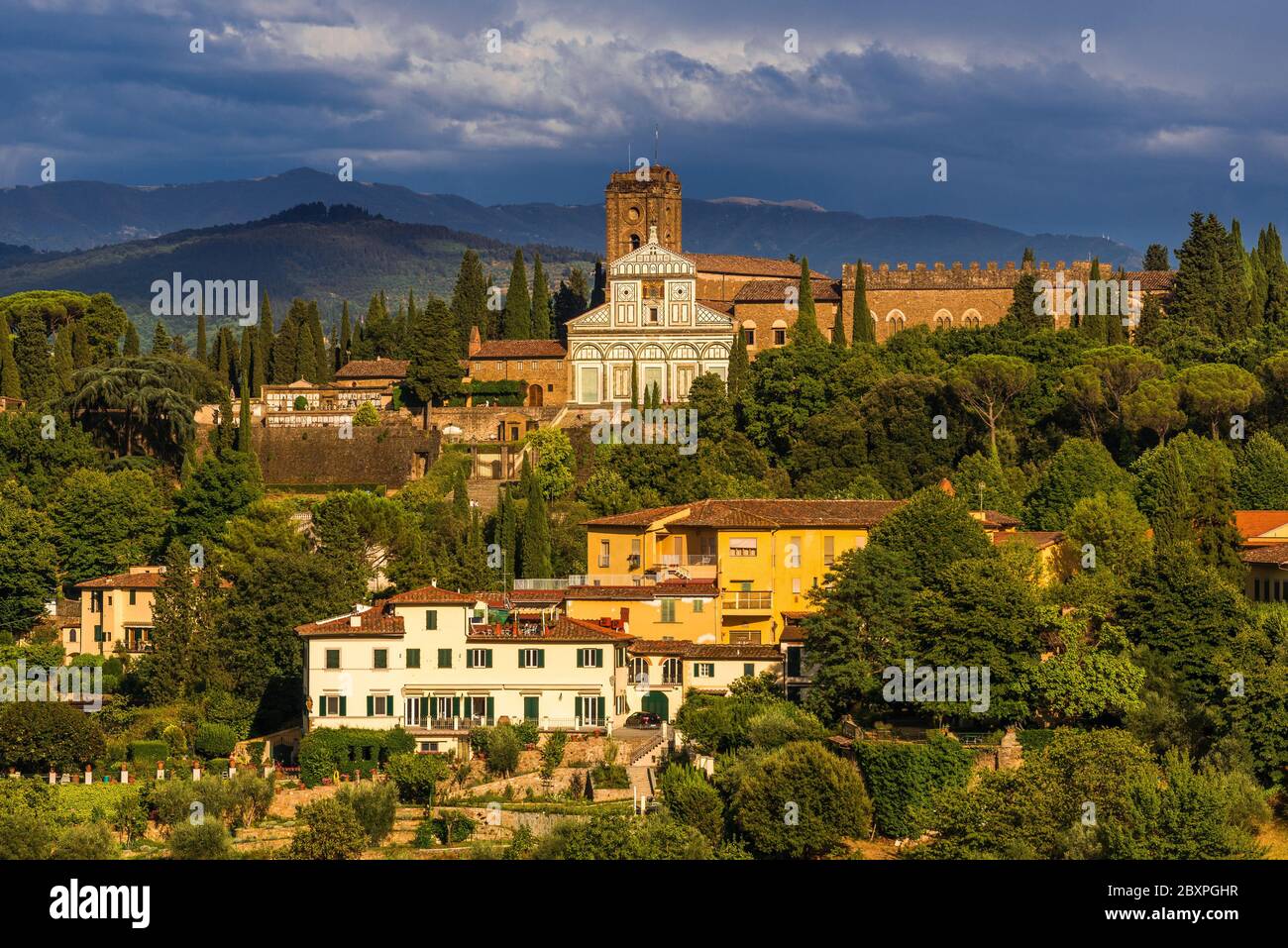 romanesque church of San Miniato al Monte in Florence, Italy, shot from the Forte di Belvedere in a hilly environment Stock Photo