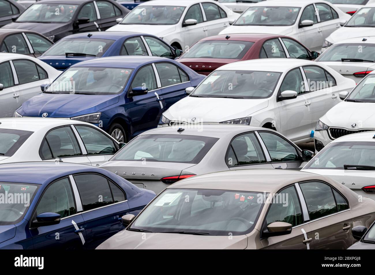 Volkswagen Group Rus, Russia, Kaluga  - MAY 24, 2020: Rows of a new cars parked in a distribution center. Top view to the parking in the open air. Stock Photo