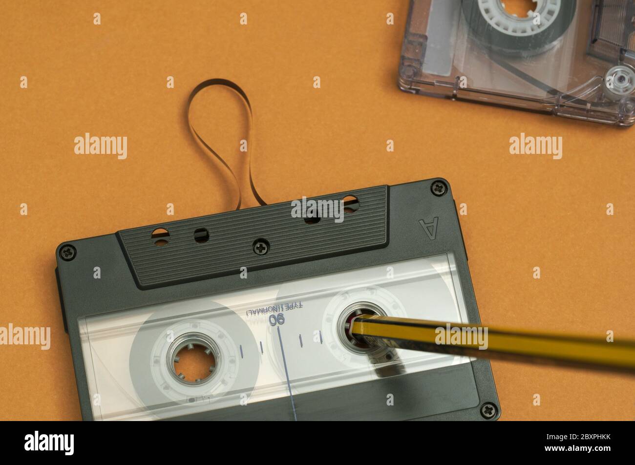 rewinding tape with pencil Stock Photo Alamy