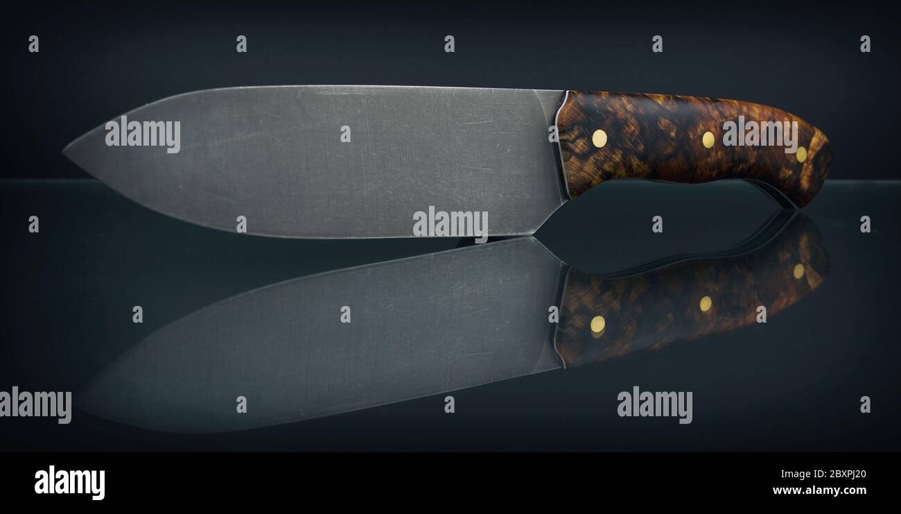 Fixed blade knife isolated on black background. Stock Photo