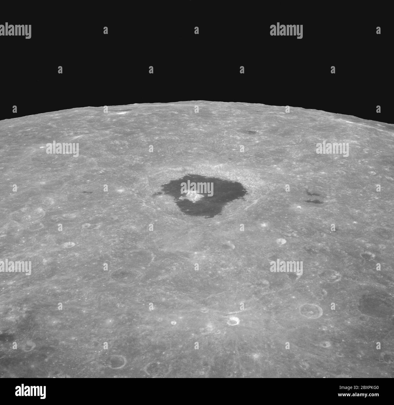 AS08-12-2196 - Apollo 8 - Apollo 8 Mission image, Tsiolkovsky; Scope and content:  The original database describes this as: Description: Apollo 8,Moon,Tsiolkovsky. Image taken on Revolution 10 during Transearth Injection (TEI). Latitude 21 South,Longitude 130 East.  Camera Tilt Mode: High Oblique, Horizon. Direction: East. Sun Angle: 68. Original Film Magazine was labeled D. Camera Data: 70mm Hasselblad. Lens: 250mm; F-Stop: F/11; Shutter Speed: 1/250 second. Film Type: Kodak SO-3400 Black and White,ASA 40. Other Photographic Coverage: Lunar Orbiter 1 (LO I) S-9,Lunar Orbiter 2 (LO II)   S-5,L Stock Photo