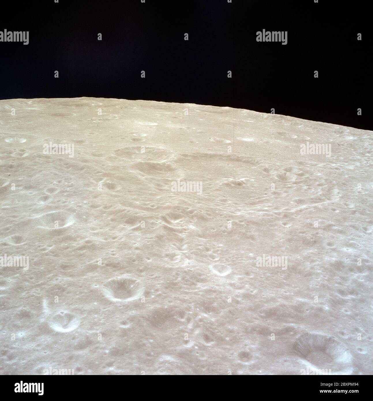 AS11-37-5433 - Apollo 11 - Apollo 11 Mission image - Views of Moon, Crater 218; Scope and content:  The original database describes this as: Description: View of Moon. High oblique view centerd on Crater 218, officially named Schuster. Image taken from inside the Lunar Module (LM) from orbital altitude over the moon during the Apollo 11 Mission. Original film magazine was labeled R.  Film Type:  Ektachrome EF SO 168 Color on a 2.5 mil Estar polyester base, taken with an 80mm lens. Approximatel Photo Scale: 1:3,028,700. Principal Point Latitude 4.0 degrees North, Longitude 146.0 degrees East. S Stock Photo