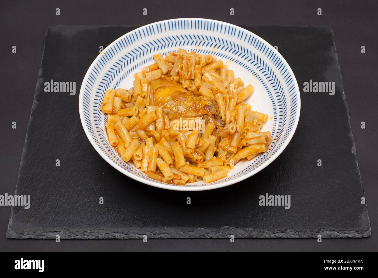 A bowl of Libyan chicken pasta known as imbakbaka Stock Photo