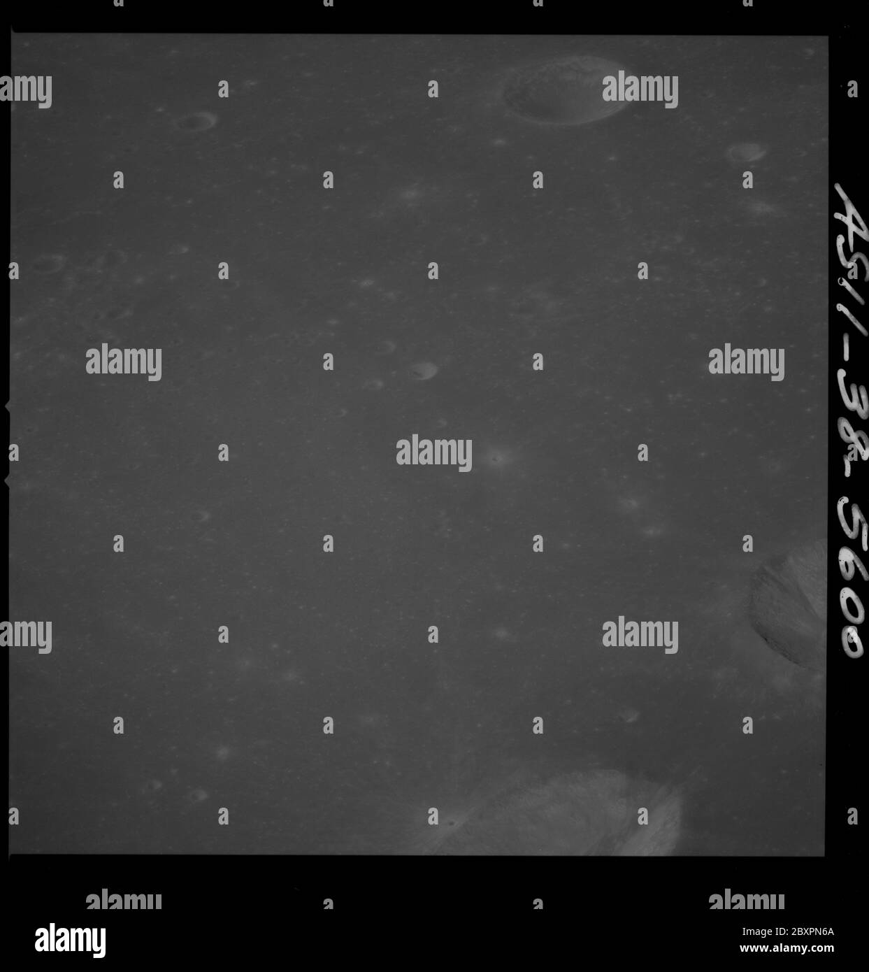 AS11-38-5600 - Apollo 11 - Apollo 11 Mission image - View of Moon, Messier and Messier A and D; Scope and content:  The original database describes this as: Description: View of Moon,Messier and Messier A and D. This image was taken from the Command and Service Module (CSM) as it traveled around the backside of the moon during the Apollo 11 Mission. Original film magazine was labeled O. Film Type: 3400 Black/White taken with a 250mm lens. Approximate Photo Scale: 1:583,000. Principle Point Latitude: 2 North,Longitude: 47.5 East. Sun angle is Medium. Approximate Tilt Minimum is 35 degrees,Maxim Stock Photo