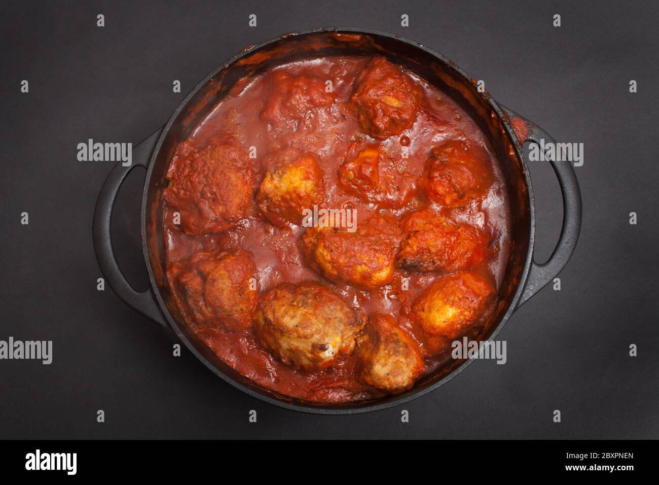 A Libyan dish called Mafrum, potatoes stuffed with mince beef and cooked in a tomato sauce Stock Photo