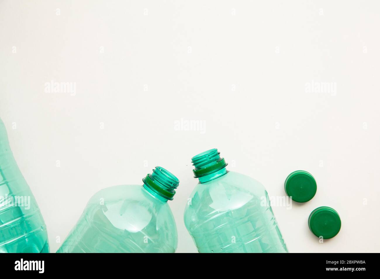Empty used green plastic water bottles for recycling. environment