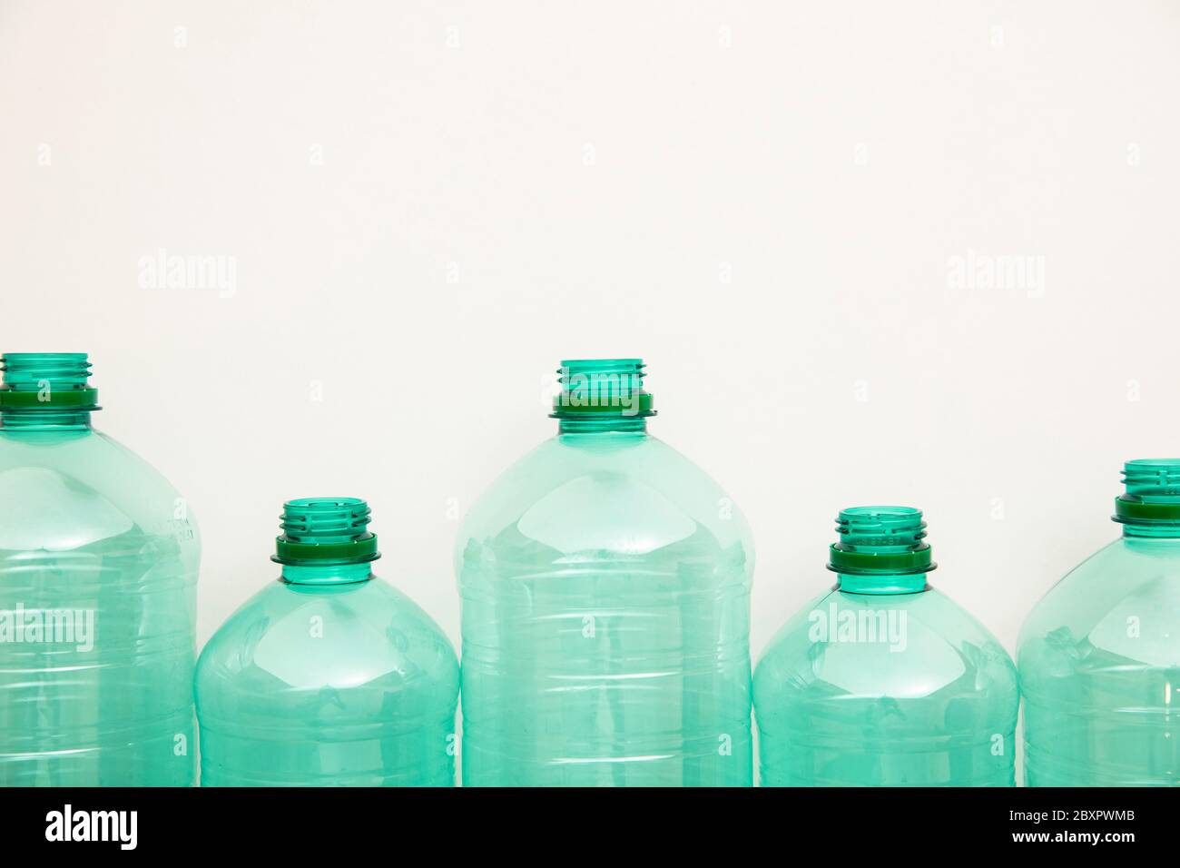 Empty used green plastic water bottles for recycling. environment