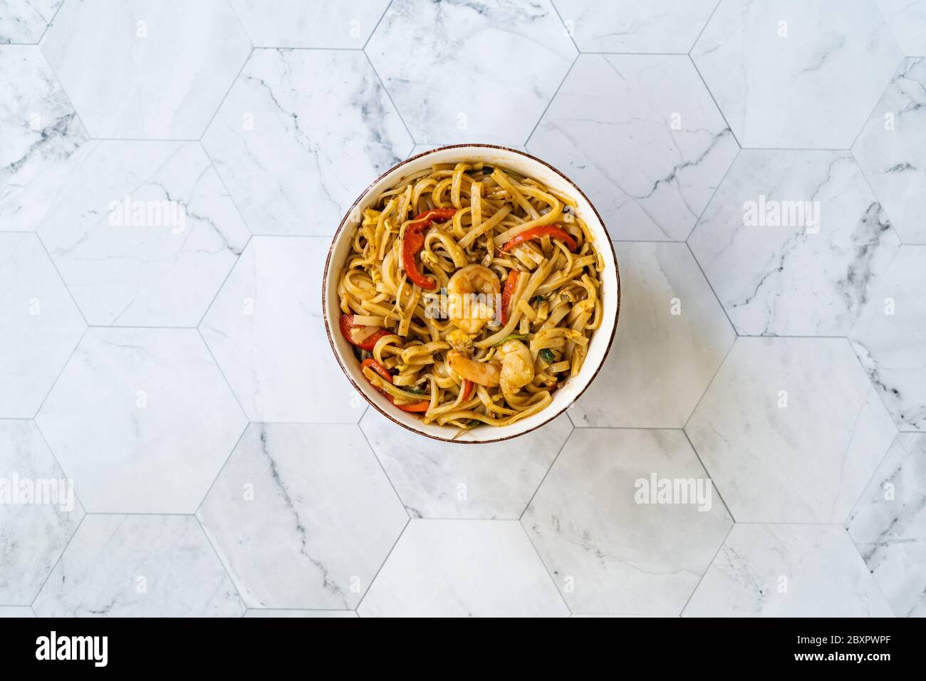 Pad Thai Noodles with Shrimp and Crushed Peanuts. Traditional Food