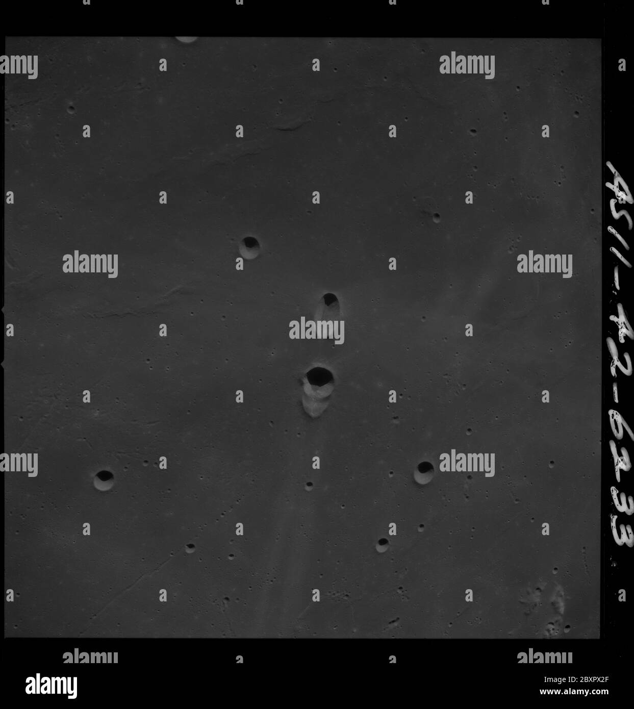 AS11-42-6233 - Apollo 11 - Apollo 11 Mission image - Messier A, Messier B, Messier; Scope and content:  The original database describes this as: Description: View of Moon,Messier A, Messier B, Messier. Image taken from the Command and Service Module (CSM) during the Apollo 11 mission while on a near circular lunar equatorial orbit. Original film magazine was labeled U.  Film Type: 3400 Panatomic-X Black/White taken with a 80mm lens.  Approximate: Photo Scale 1:1,944,500. Principle Latitude is 1 degrees South and Longitude: 47 degrees East. Sun angle is Low. Approximate Tilt is 45 degrees. Tilt Stock Photo