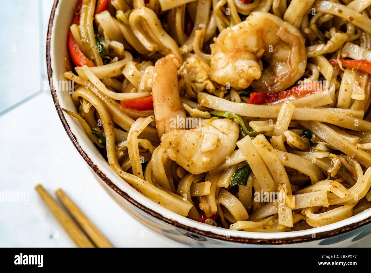 Pad Thai Noodles with Shrimp and Crushed Peanuts. Traditional Food