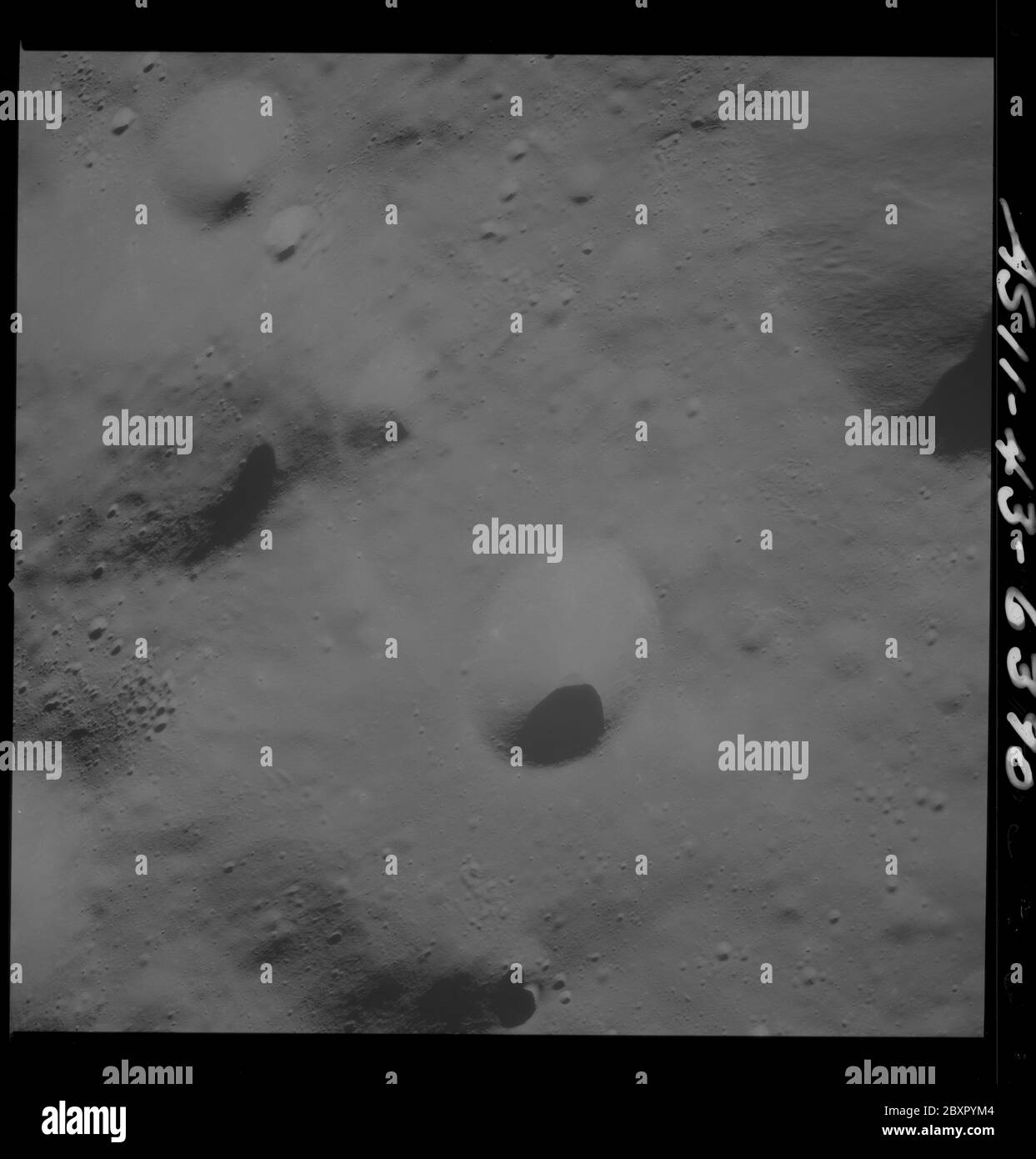 AS11-43-6390 - Apollo 11 - Apollo 11 Mission image - Moon, Southwest of Crater 229; Scope and content:  The original database describes this as: Description: View of Moon,Southwest of Crater 229,officially named Krasovskij. Image take from the Command Module at approximately 60 nautical miles orbital altitude during the Apollo 11 Mission.  Original film magazine was labeled T. Film Type: 3400 Black/White Panatomic-X film on a 2.5 mil Estar polyester base taken with a 250mm lens. Approximate Photo Scale: 1:583,000. Principal Point Latitude 2 degrees North,Longitude 177.5 degrees West. Foward ov Stock Photo