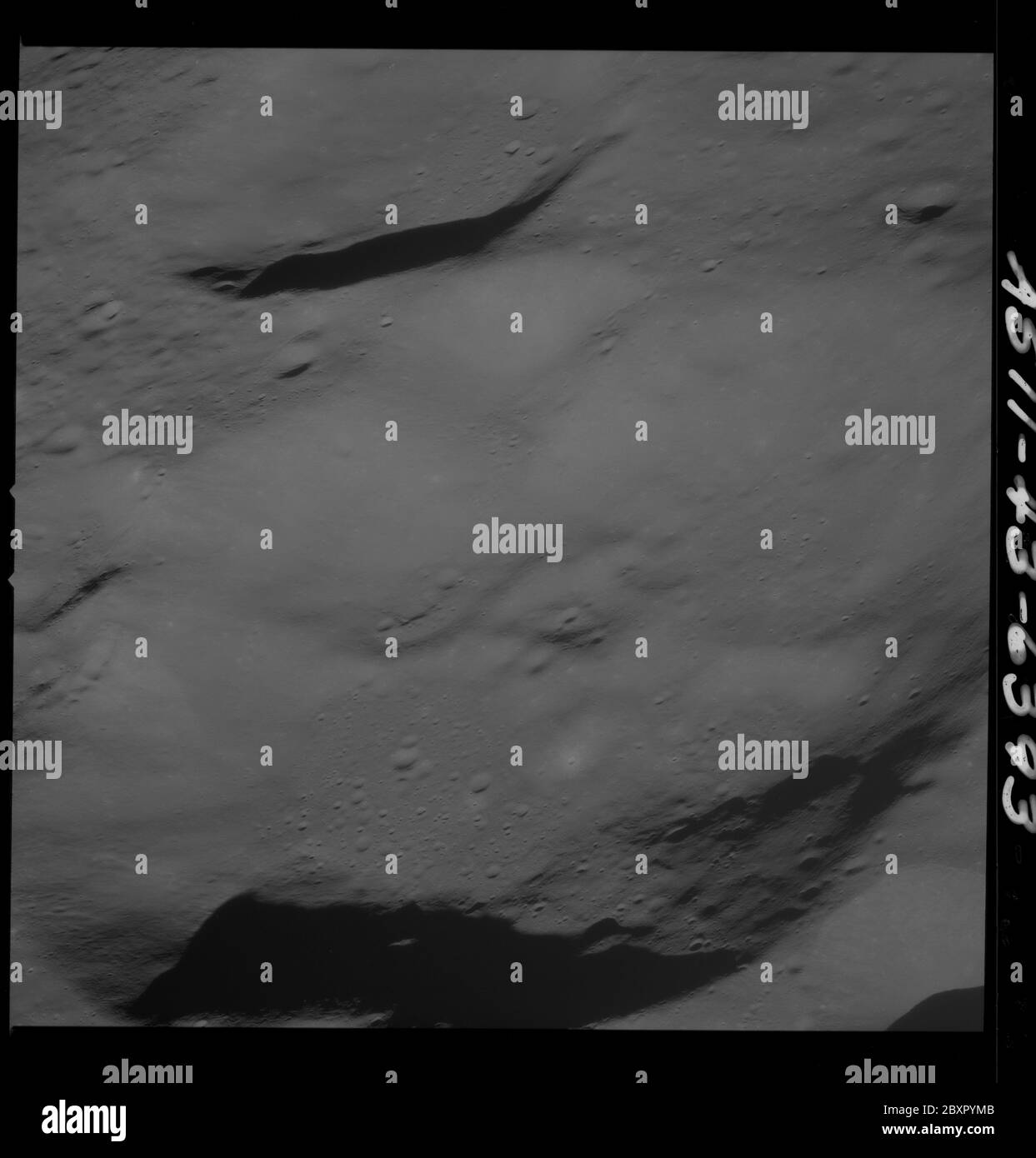 AS11-43-6393 - Apollo 11 - Apollo 11 Mission image - Moon, Southwest of Crater 229; Scope and content:  The original database describes this as: Description: View of Moon,Southwest of Crater 229,officially named Krasovskij. Image take from the Command Module at approximately 60 nautical miles orbital altitude during the Apollo 11 Mission.  Original film magazine was labeled T. Film Type: 3400 Black/White Panatomic-X film on a 2.5 mil Estar polyester base taken with a 250mm lens. Approximate Photo Scale: 1:583,000. Principal Point Latitude 1 degrees North,Longitude 177 degrees West. Foward over Stock Photo