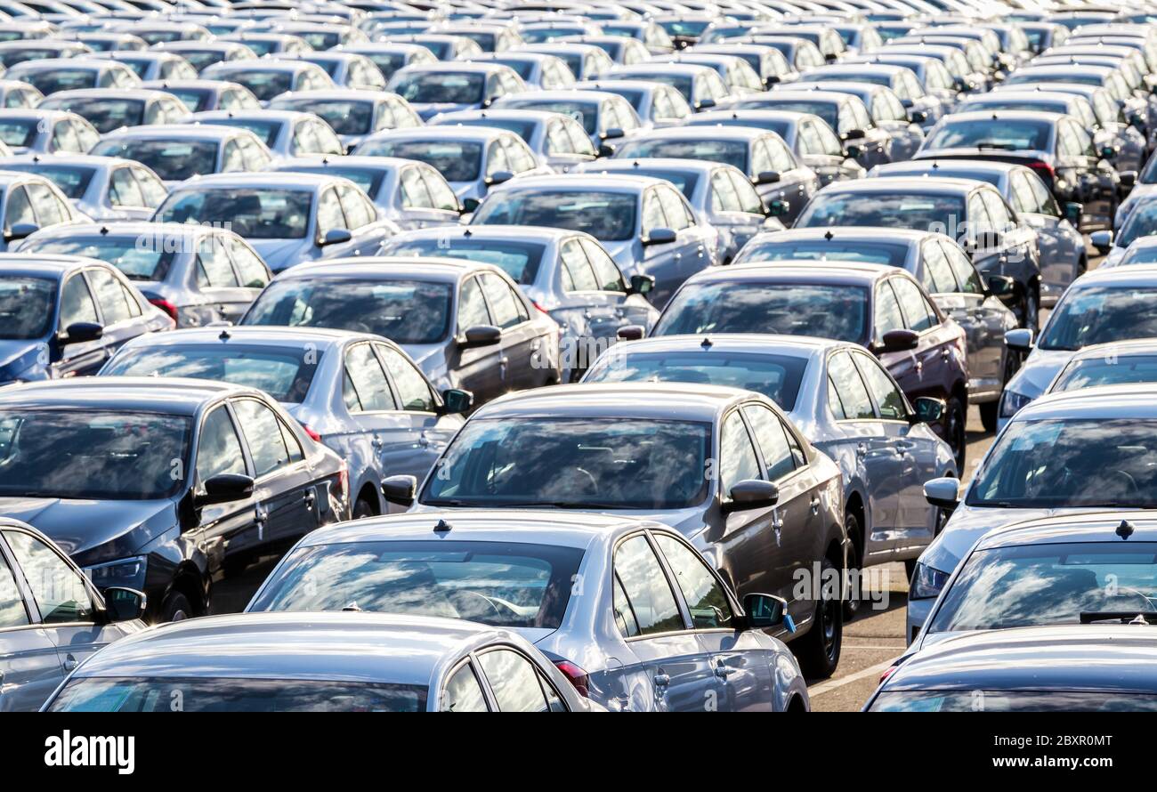 Large parking lot of new cars waiting for delivery and export, at