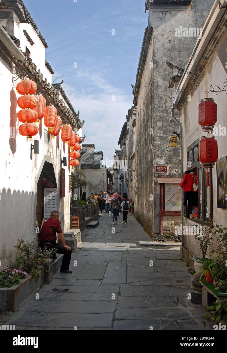 Xidi Ancient Town in Anhui Province, China. Old town of Xidi with historical buildings, cobbled street and red lanterns. Stock Photo