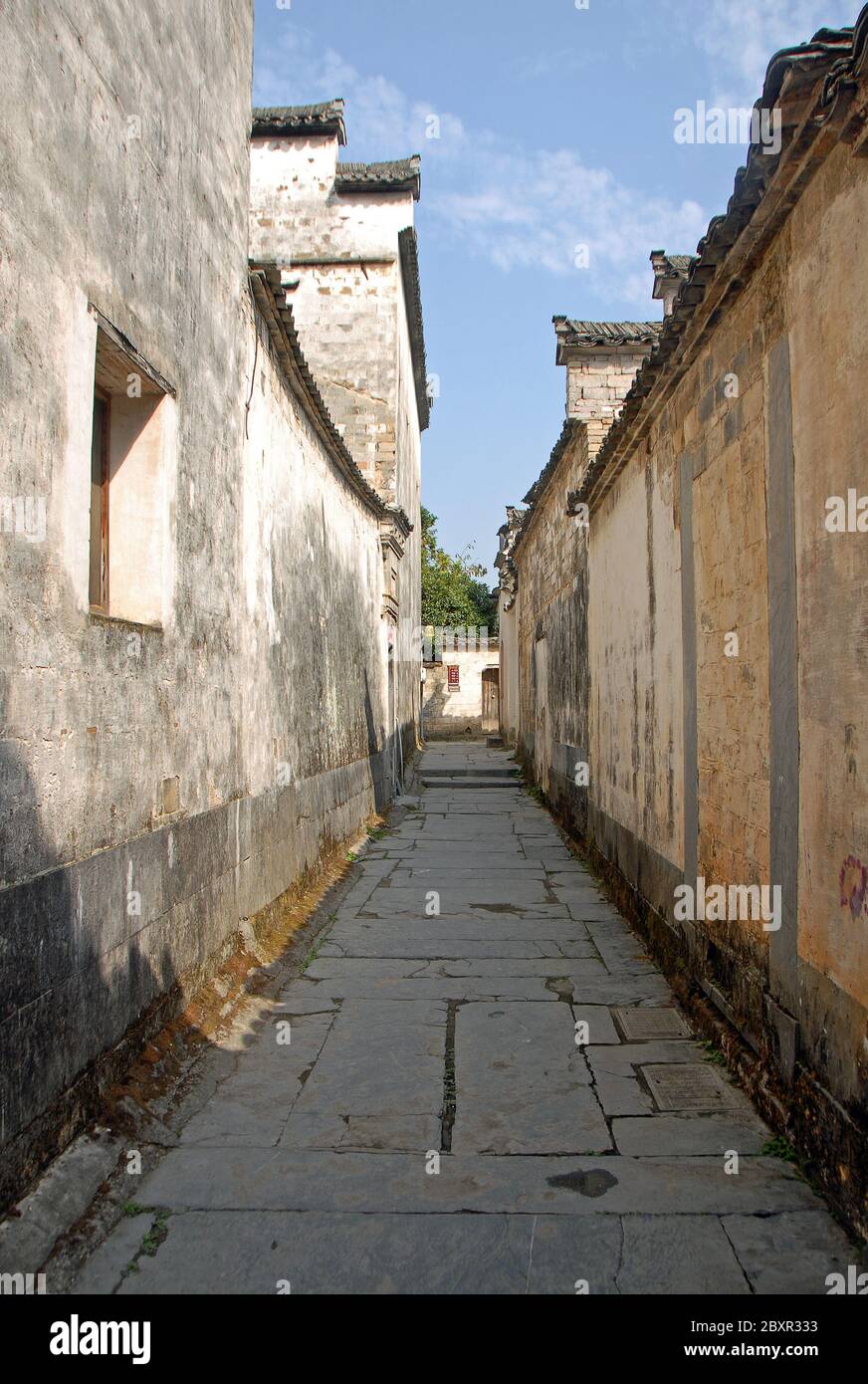 Xidi Ancient Town in Anhui Province, China. A backstreet in the old town of Xidi with historical buildings and flagstone path Stock Photo
