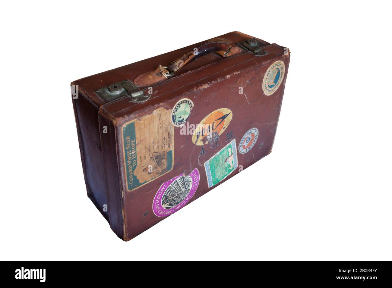 Old battered leather suitcase with worn travel stickers Stock Photo - Alamy