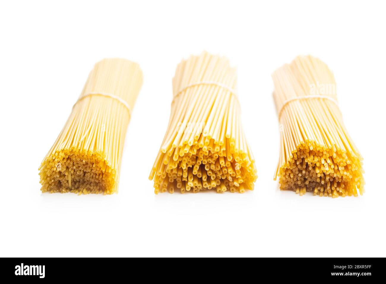 Raw spaghetti pasta isolated on white background. Stock Photo