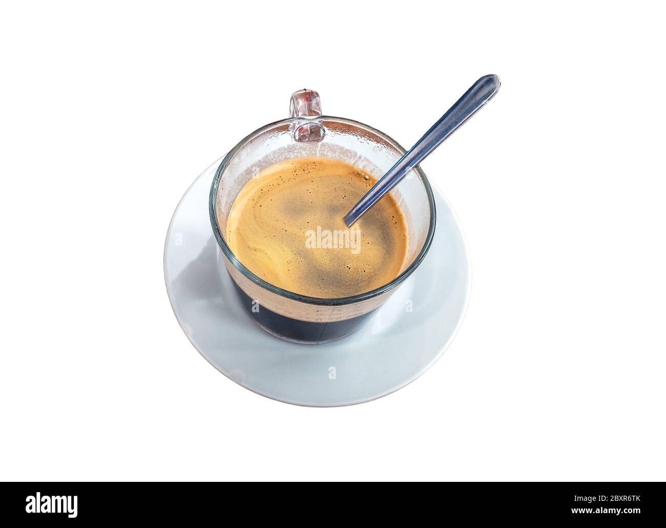 Black cup of espresso coffee with a spoon and saucer Stock Photo Alamy