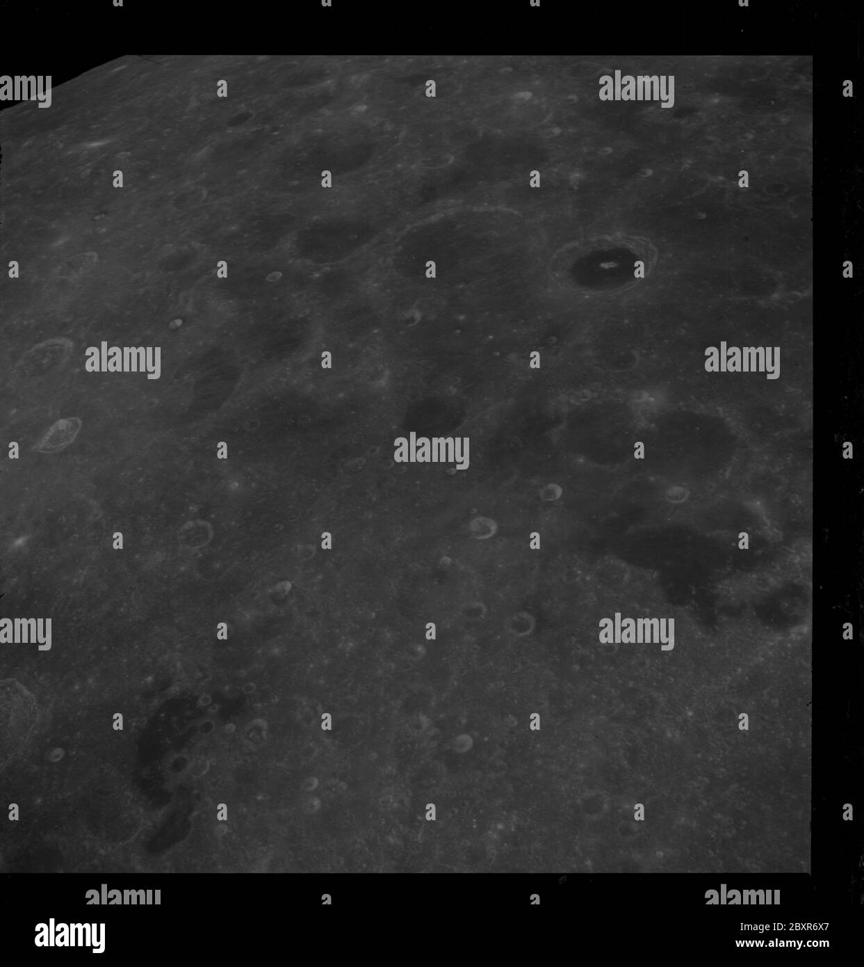 AS08-12-2212 - Apollo 8 - Apollo 8 Mission image, Mare Australe and T/O 52; Scope and content:  The original database describes this as: Description: Apollo 8,Moon,Mare Australe, Target of Opportunity (T/O) 52, Mare patches and light-dark crater. Image taken on Revolution 10 during Transearth Injection (TEI). Latitude 37 South,Longitude 101 East. Camera Tilt Mode: Low Oblique. Direction: South. Sun Angle: 47. Original Film Magazine was labeled D. Camera Data: 70mm Hasselblad. Lens: 250mm; F-Stop: F/11; Shutter Speed: 1/250 second. Film Type: Kodak SO-3400 Black and White,ASA 40. Other Photogra Stock Photo