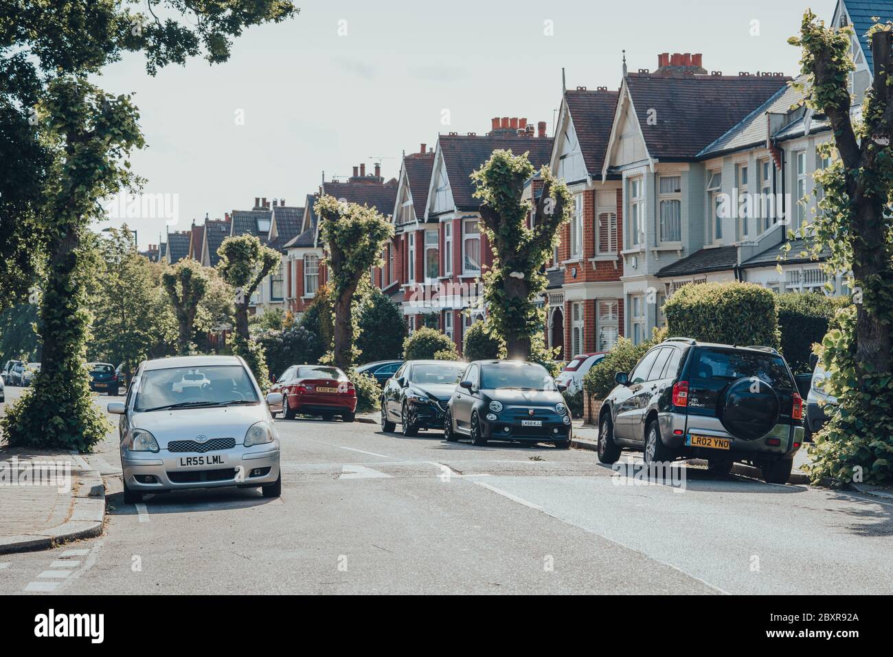 London, UK May 26, 2020 Cars parked in front of houses on both sides
