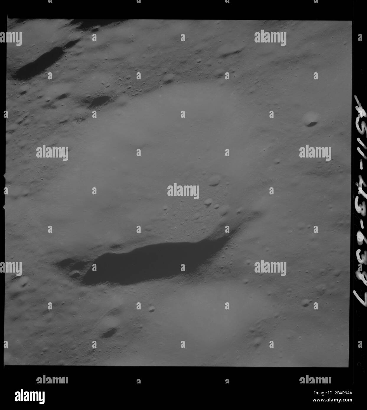 AS11-43-6387 - Apollo 11 - Apollo 11 Mission image - Moon, South of Crater 229; Scope and content:  The original database describes this as: Description: View of Moon,South of Crater 229,officially named Krasovskij. Image take from the Command Module at approximately 60 nautical miles orbital altitude during the Apollo 11 Mission.  Original film magazine was labeled T. Film Type: 3400 Black/White Panatomic-X film on a 2.5 mil Estar polyester base taken with a 250mm lens. Approximate Photo Scale: 1:583,000. Principal Point Latitude 1 degrees North,Longitude 176 degrees West. Foward overlap is 0 Stock Photo