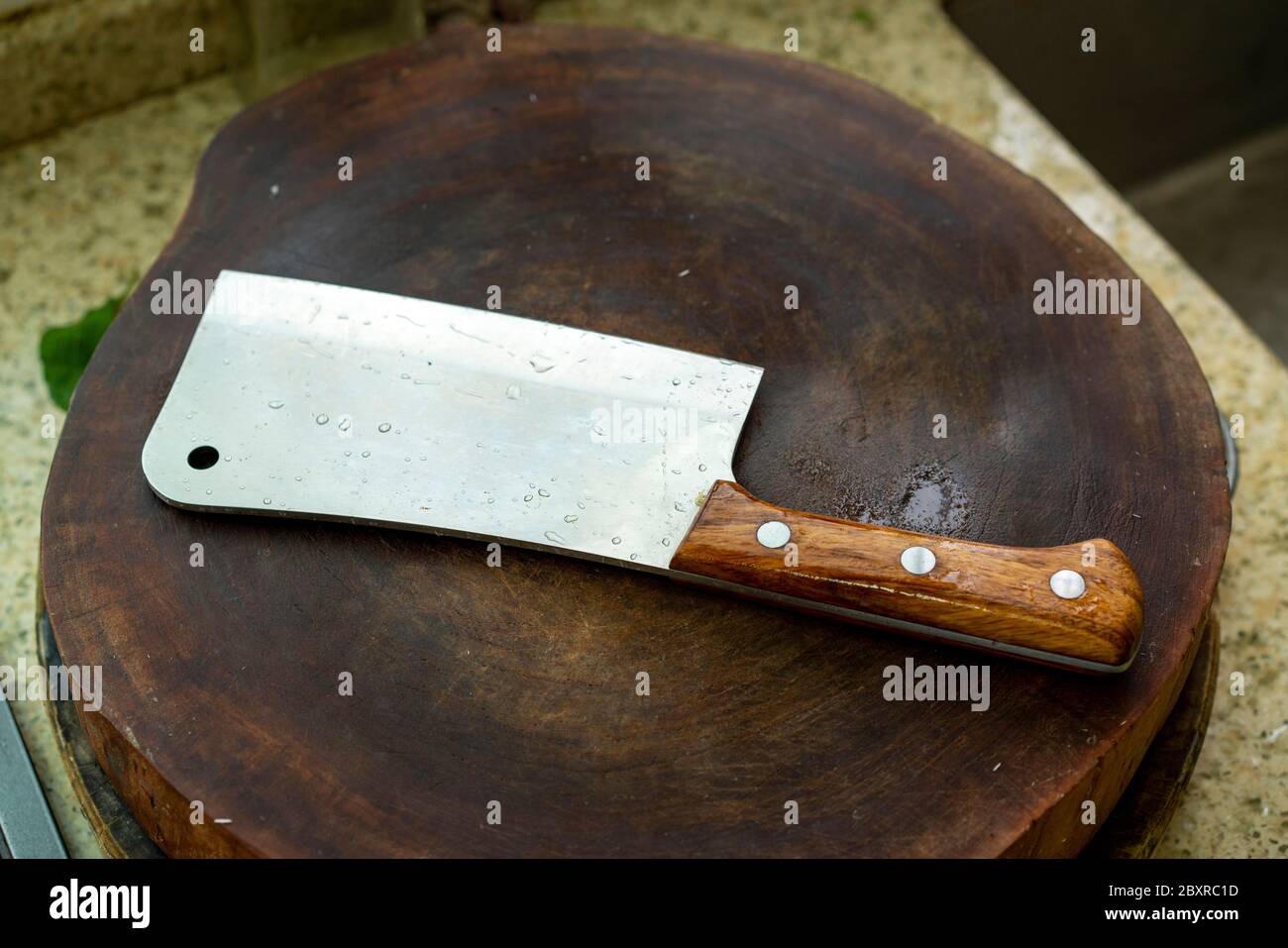 A kitchen knife on a cutting board in the kitchen Stock Photo
