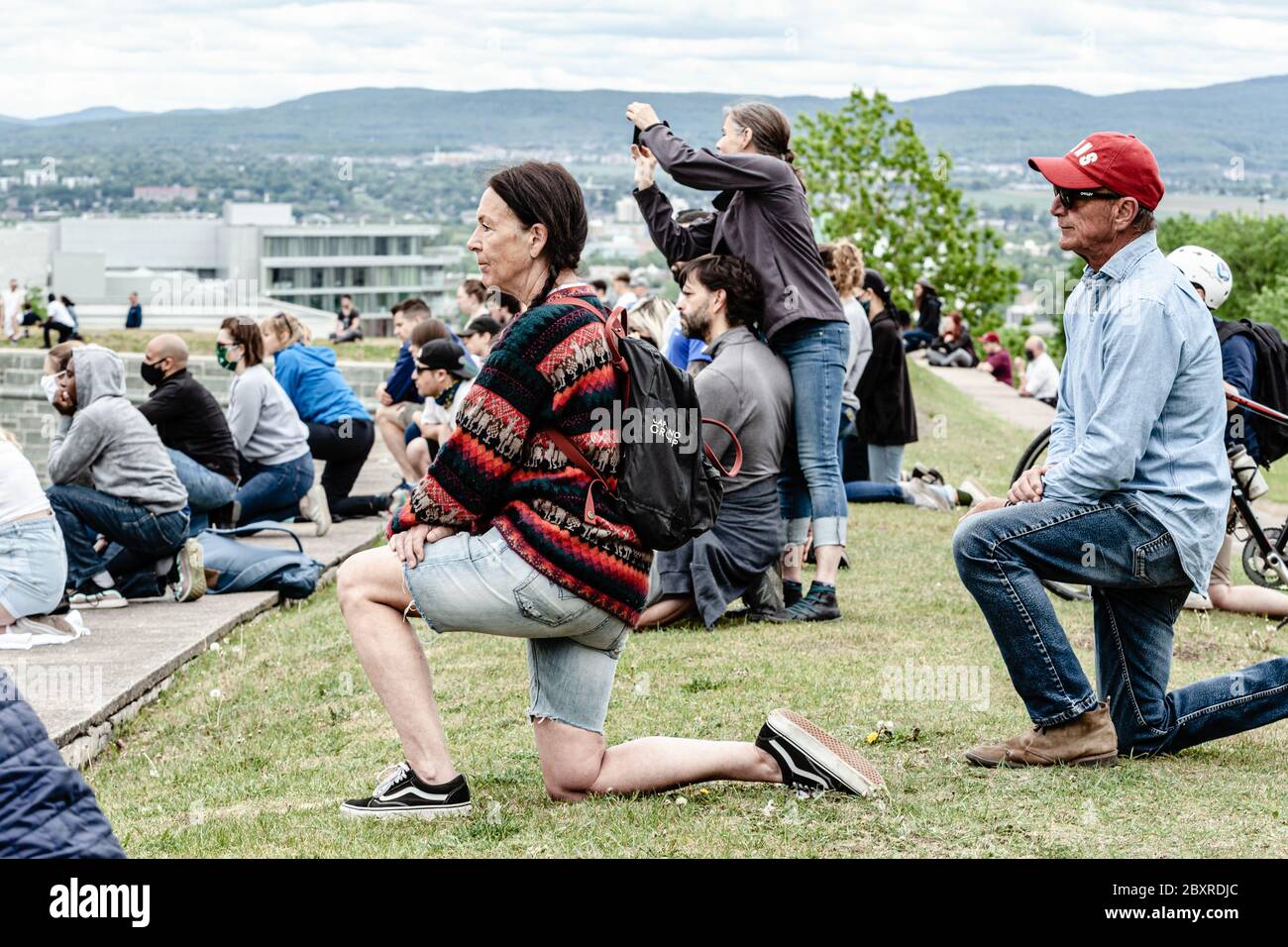 Quebec City, Canada. 7th June, 2020. some people kneeling during the 8min 46s of George Floyd memorial at the anti-racism peaceful rally of Quebec City, Credit: Francois OZAN/Alamy Live News Stock Photo