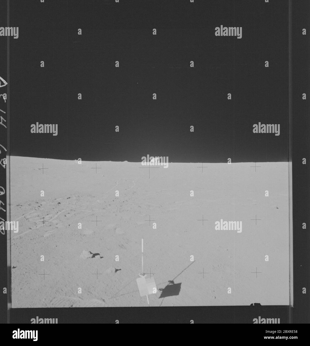 AS14-68-9413 - Apollo 14 - Apollo 14 Mission image - View of a color chart and the Gnomon witth the Lunar Module on the Horizon and MET trail leading from it.; Scope and content:  The original database describes this as: Description: View of a color chart and the Gnomon witth the Lunar Module on the Horizon and Modular Equipment Transporter (MET) trail leading from it. Samples no. 14041,10442 and  14043 are photographed before retrieval (after sampling).   Images were taken by during EVA 2 of the Apollo 14 mission. Original film magazine was labeled MM,film type was S0-267 (High Speed Black an Stock Photo