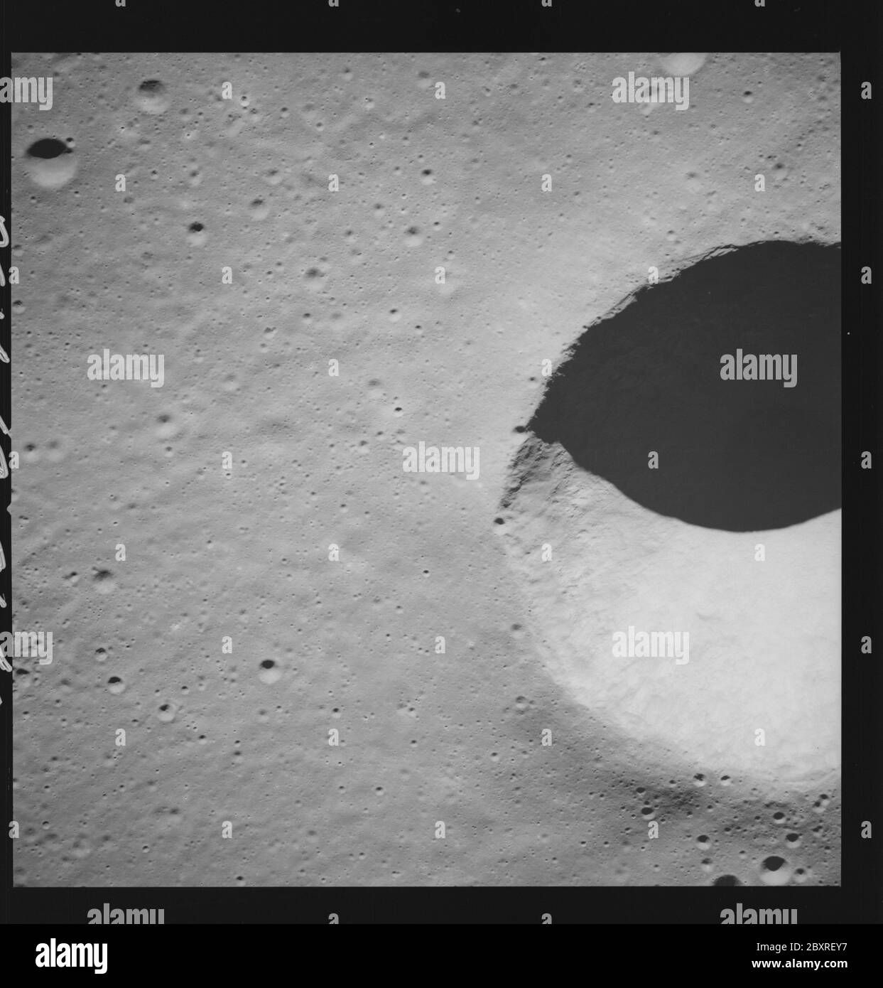 AS14-69-9640 - Apollo 14 - Apollo 14 Mission image - Near vertical view of the Lansberg B Crater.; Scope and content:  The original database describes this as: Description: Near vertical view of the Lansberg B Crater. Images were taken on Revolution 30 of the Apollo 14 mission. Original film magazine was labeled P,film type was 3400BW (Panatomic-X,Black and White),500mm lens with a sun elevation of 21 degrees. Approximate Photo Scale was 1:222,000. Principal Point Lattitude was 2.5S by Longitude 28.0W,with a camera tilt of 0-10 degrees and an azimuth of 285 degrees. Subject Terms: Apollo 14 Fl Stock Photo