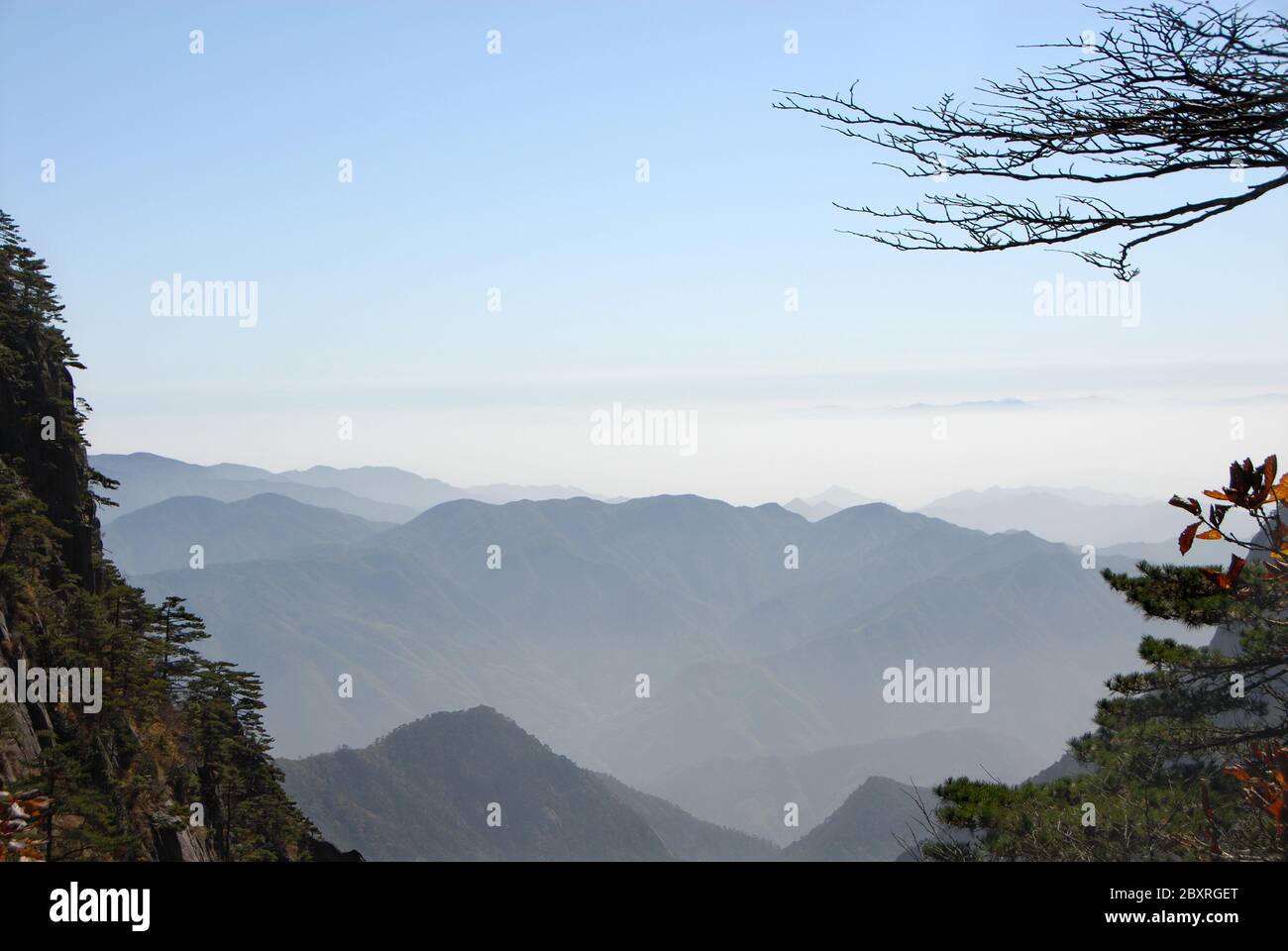 Huangshan Mountain in Anhui Province, China. A beautiful panoramic view of a valley on Huangshan looking out over distant mountains Stock Photo