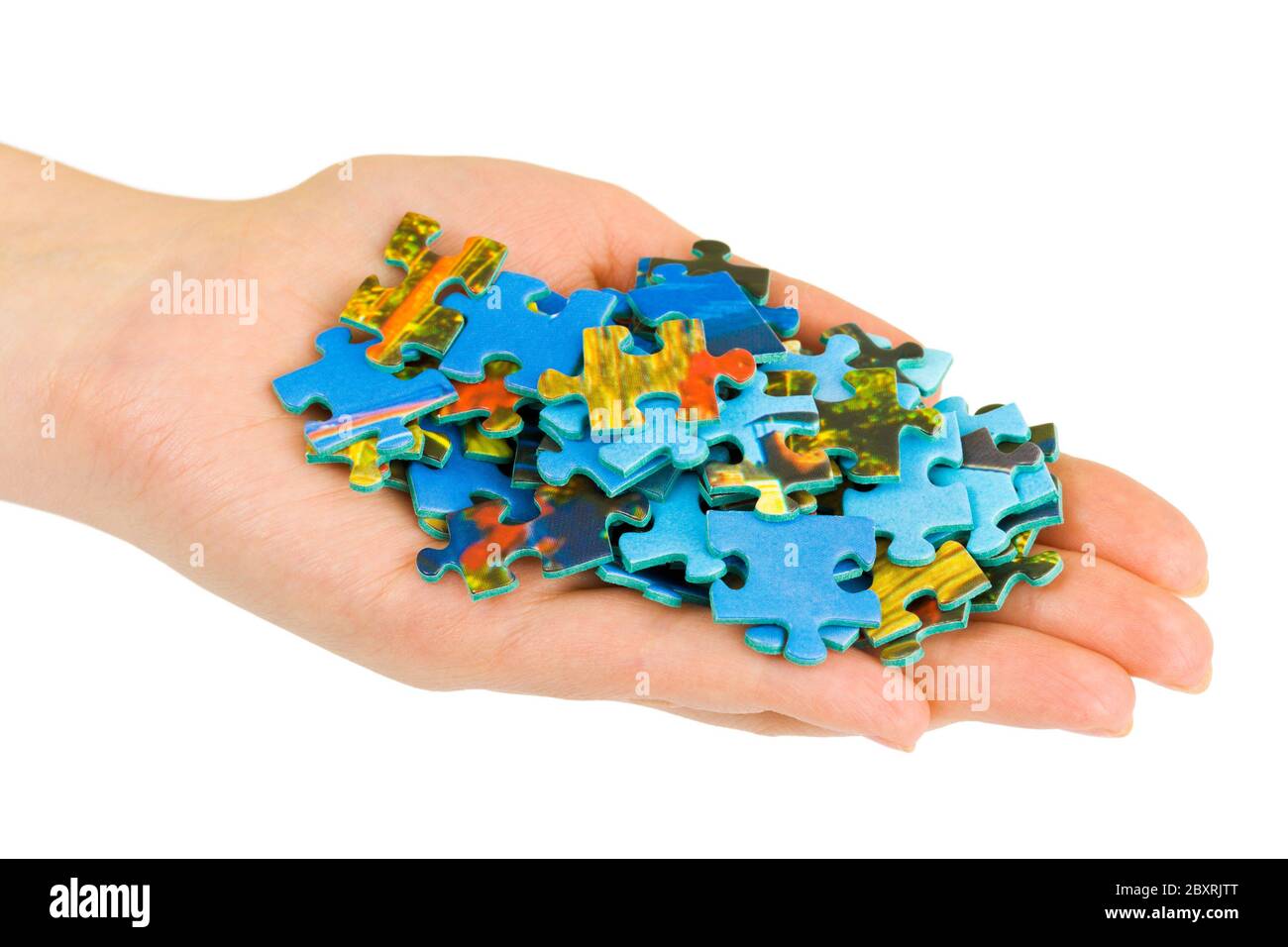 Hand and puzzle Stock Photo - Alamy