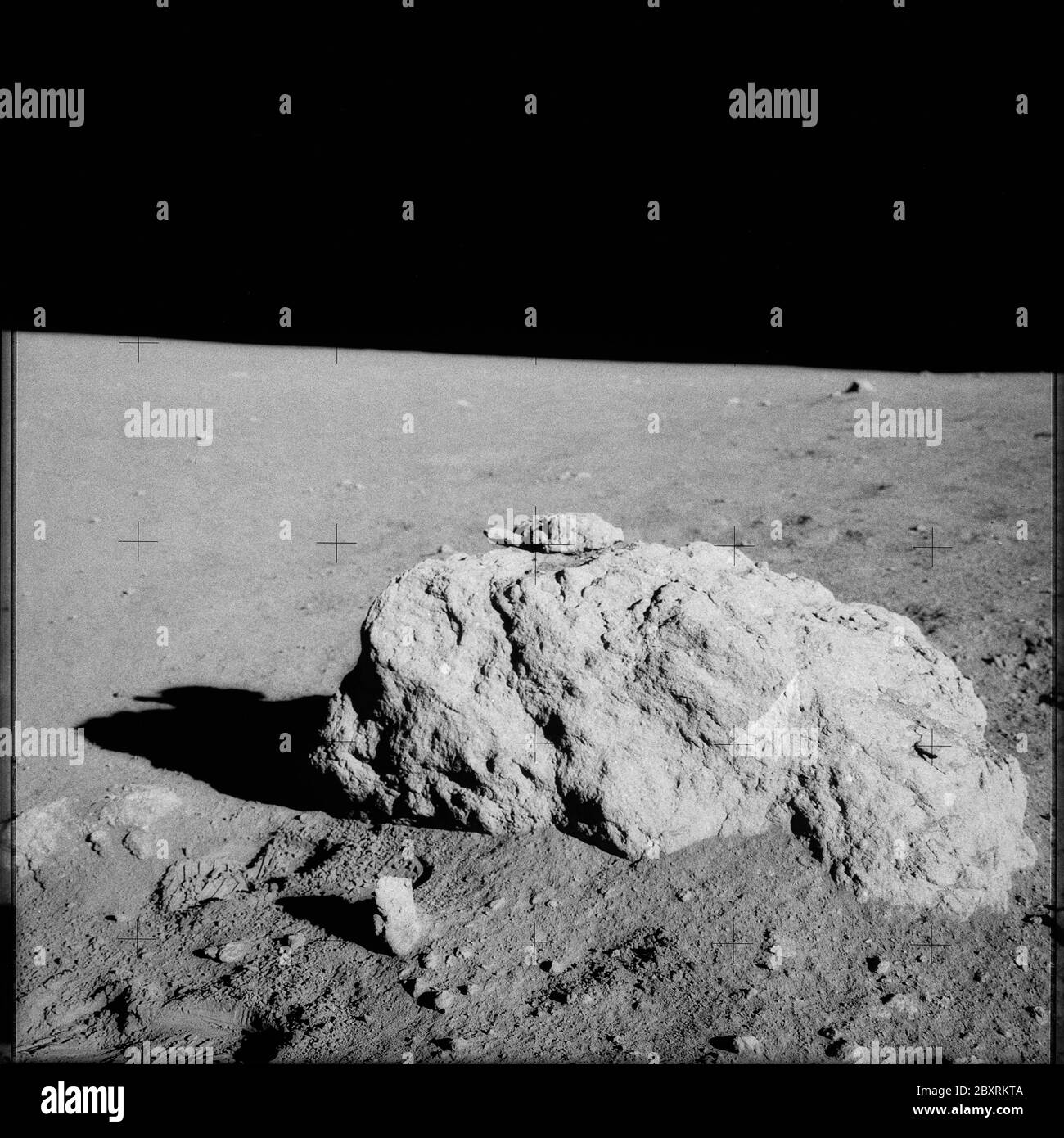 AS14-68-9476 - Apollo 14 - Apollo 14 Mission image - View of a large rock.; Scope and content: The original database describes this as: Description: View of a large rock. Sample no. 14319 is photographed before retrieval (after sampling). Images were taken by during EVA 2 of the Apollo 14 mission. Original film magazine was labeled MM,film type was S0-267 (High Speed Black and White Thin Base Film),60mm lens with a sun elevation of 24 degrees and a northwestern azimuth. Subject Terms: Apollo 14 Flight, Moon (Planet) Categories: EVA Original: Film - 70MM B&W Interior_Exterior: Exterior Ground Stock Photo